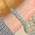 Minimalist light blue crystal bead bracelet with ice-crack texture on a woman's wrist - Ice Cracked Light Blue Beaded (MY38011)