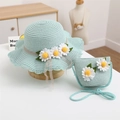 Detail of mint green straw hat and matching crossbody bag with white daisy flowers - Hat and Bag Set / Mint Green