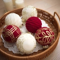 Close-up of six red and white velvet Christmas balls with gold glitter patterns in a basket - Red White Velvet Gold Glitter (Q-A02-56)