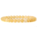 Elastic beaded bracelet featuring 6mm smooth light yellow natural stone beads in a round shape - Natural Yellow Jade