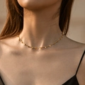 Minimalist 18K gold plated brass necklace with small round disc pendants on model - 18K Gold