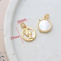 Macro view of 14k gold-filled round shell pendant with portrait relief, 15mm diameter - 5# Round Cameo Portrait
