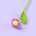 Handmade knitted flower with purple petals and yellow center on light background - Finished Daisy Branches (light Purple)