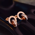 Rose gold interlocking double ring earrings with Roman numerals and zircon stones - Stud Earrings / Rose Gold