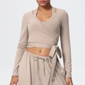 Detail of almond yoga set featuring a wrap-around tie waist and soft brushed fabric texture - Flaxen