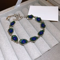 Elegant beaded silver bracelet with vintage peacock enamel eyes and adjustable chain - Exotic Style Blue-Green Enamel Style