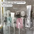 Wall-mounted tooth brush holder with four colored ripple cups and toothpaste dispenser - 4 Cups (Clear & Pink & Grey & Blue) + Bow + Dispenser