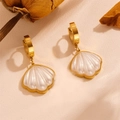 Macro shot of gold shell earrings with pearl white pendants on textured background - L606 Shell Stud Earrings (Gold)