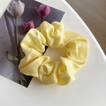 Pale yellow satin scrunchie with silky smooth texture and rich pleats on white surface - 4# Goose Yellow
