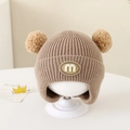 Winter baby beanie in beige with double pom-poms and fleece ear protection - Letter M - Coffee