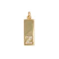 Macro detail of golden rectangular pendant featuring zircon letter Z and top loop - Letter Z