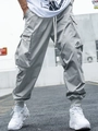 Close-up of grey men's cargo joggers with multiple pockets and street industrial style - M / Bottoms / Slate Gray