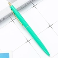 Green retractable ballpoint pen with gold clip and trim on white grid background - 1.0mm Bullet Tip / Green