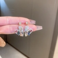 Golden heart earrings with colorful crystals and opal accents shown in hand - Exquisite Multicolor Heart (52#) / Gold/Multicolor