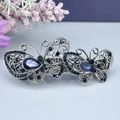 Barrette papillon argentée ornée de strass bleus et de cristaux étincelants - Double Papillon