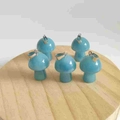 Mini sky blue mushroom pendants made of natural stone with silver metal clasps on wood - Synthetic Peacock Blue