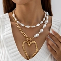 Detail of layered gold chain and baroque pearl necklace with a large hollow heart pendant - Gold (Layered Pearl Metal Chain Gold Heart)