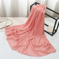Pink chiffon scarf draped on a black metal stand with magazine and marble background - 175cmx70cm / Carmine Pink