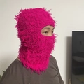Detail of rose red fuzzy balaclava mask showing rich knit texture on female model - One Size / Rose Red