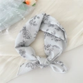 Gray cotton linen square scarf with black floral print tied as a decorative headband - Line Flower Beige Grey