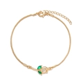 Elegant gold tulip bracelet with green crystals and sleek snake chain on white background - Bracelet-White