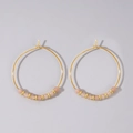Exaggerated gold hoop earrings with faceted light pink semi-precious stone beads - Light Pink Beaded Gold Hoop