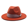 Detail of orange wool fedora featuring a purple silk band and silver rhinestone buckle - Rust red