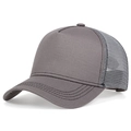 Close-up of dark grey trucker hat showing breathable mesh back and seamless five-panel crown - Gray