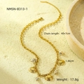 Detail view of 18k gold plated stainless steel ocean shell necklace with natural conch pendants - Gold Link Multi-Shell Pendant Necklace