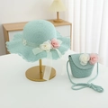 Close-up of mint green straw hat and matching bag with decorative floral accents - Hat And Bag / Blue