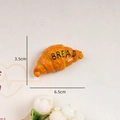 Creative 3D resin croissant fridge magnet in bright orange with BREAD text detail - Croissant