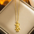 Golden titanium steel teddy bear necklace with heart gemstone on a jewelry display tray - 8858 Golden Violent Bear