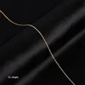 Detailed view of an 18k gold plated stainless steel cable chain on black silk - O-Chain / Gold