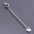 Silver lobster clasp extension chain for necklaces on a grey matte surface - S1655 Patterned Round Tag With Clasp / Silver