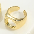 Macro shot of chunky 14K gold plated adjustable ring with hollow design on white background - Round Hollow Ring (JZ0376-4)