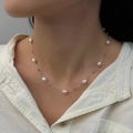 Close-up of elegant freshwater pearl necklace worn on model with white shirt - Silver Metal White Pearl Choker (O-a-025)