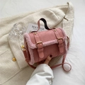 Pink plush trimmed cylindrical handbag with gold buckles and matte faux leather texture - Pink