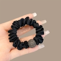 Elastic black satin scrunchie featuring a sparkling rhinestone-studded decorative ball - Black Rhinestone Scrunchie