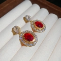 Close-up of vintage gold-plated oval earrings with red gems and sparkling zircons - Red (Gold Base, Silver Pin)