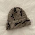 Oatmeal knitted beanie for women featuring multiple black bow accents for autumn - Khaki
