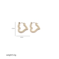 Detailed view of gold heart earrings with woven texture and size markings 2.3cm - Woven Texture Heart