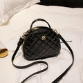 Elegant black quilted handbag with gold floral logo and crossbody strap for women - Black