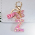 Pink resin alphabet letter Z keychain with glitter sequins and butterfly tassel pendant - Letter Z