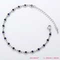 Detailed view of silver chain bracelet with bezel-set blue crystals and lobster clasp - Bracelet / Platinum / Blue Zirconia