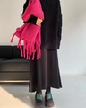 Soft pink tassel cashmere-like scarf styled over a black sweater for a warm winter look - Rose Red