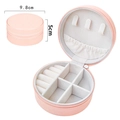 Pink portable round travel jewelry case with white velvet lining for rings and necklaces - Pink