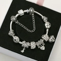 Silver-plated charm bracelet with heart, bow, and sparkling beads in a jewelry box - Silver Bracelet - 3