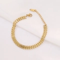 Detailed close-up of a gold-plated stainless steel mesh bracelet with adjustable lobster clasp - Gold