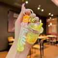 Detail of yellow milk tea cup keychain with liquid glitter and yellow bubble hand strap - Yellow Luminous Bubble Bead Milk Tea Cup