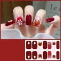 Christmas gel nail wraps with red reindeer and snowflake patterns for holiday manicure - CS440
